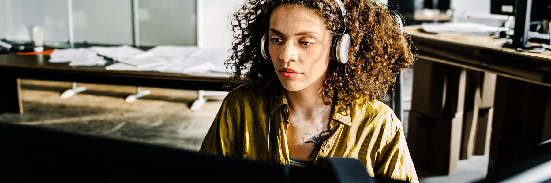 Cisco support engineer in headphones at a desk, from Cisco's Model Context Protocol announcement